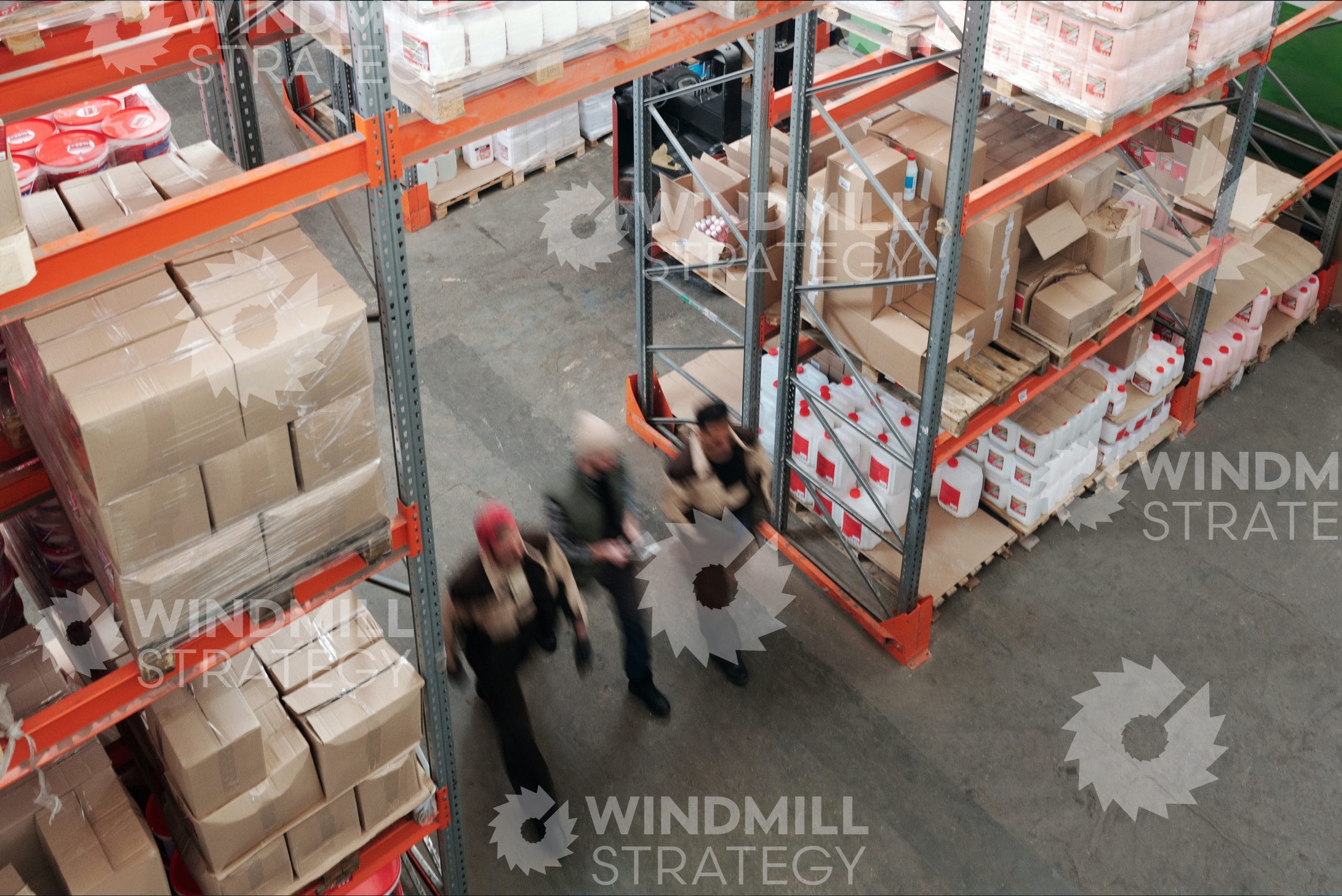 Warehouse workers walking through a warehouse